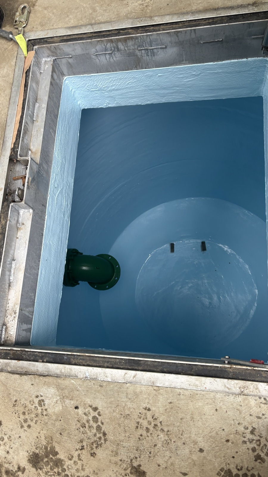 Coated concrete access vault